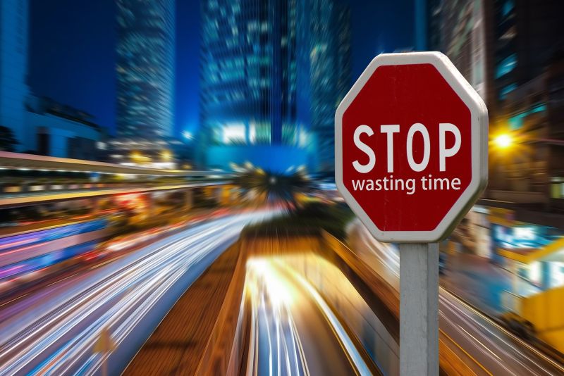Stop Wasting Time Sign on Highway